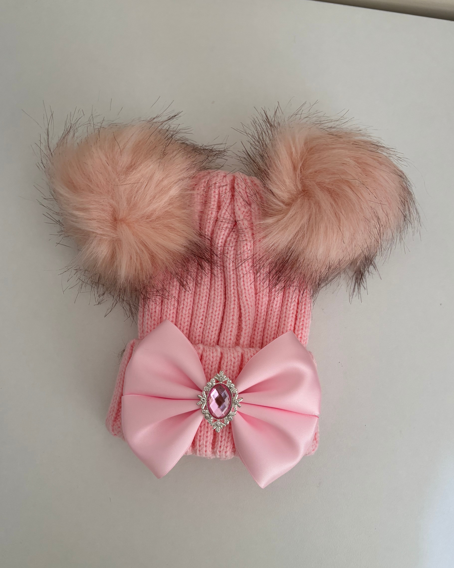 Pink pom pom hat