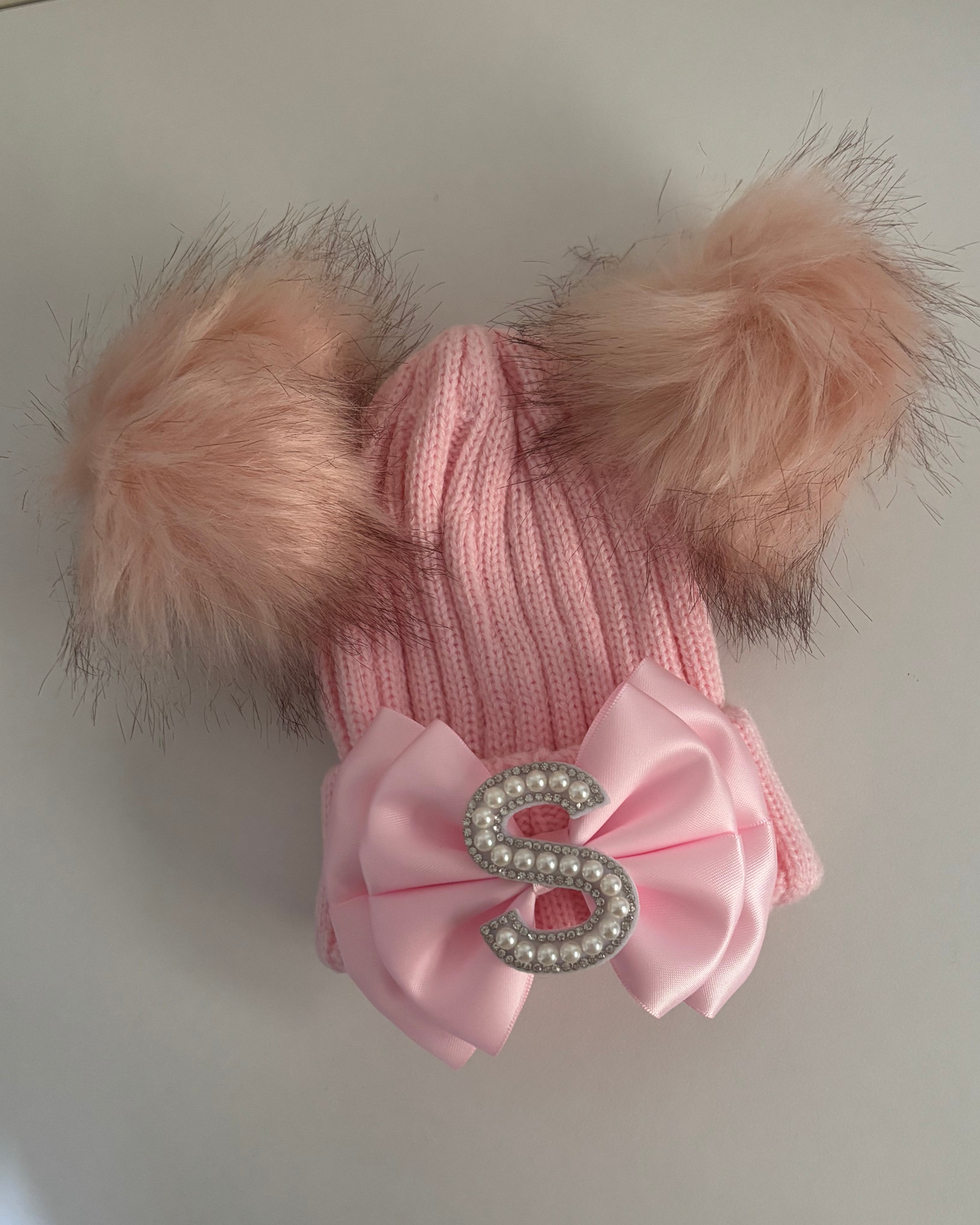 Pink pom pom hat