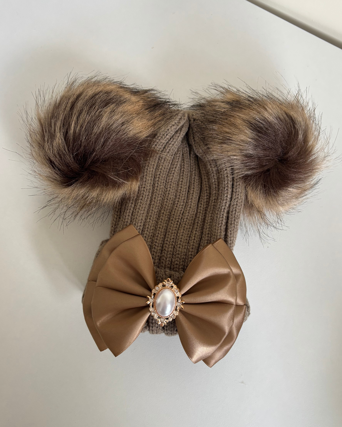 Brown pom pom hat