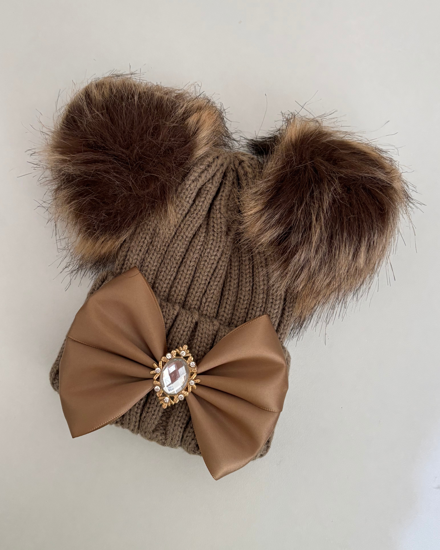 Brown pom pom hat