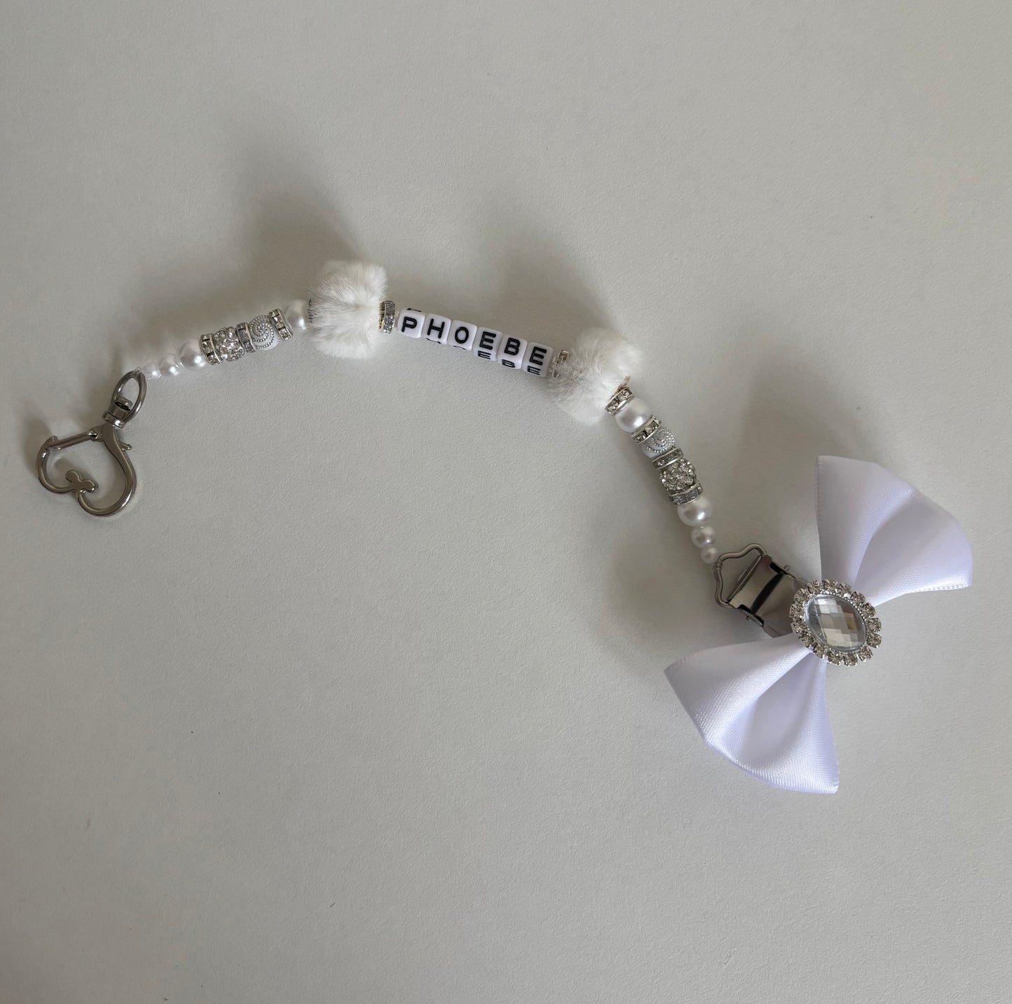 White fluffy bead dummy clip