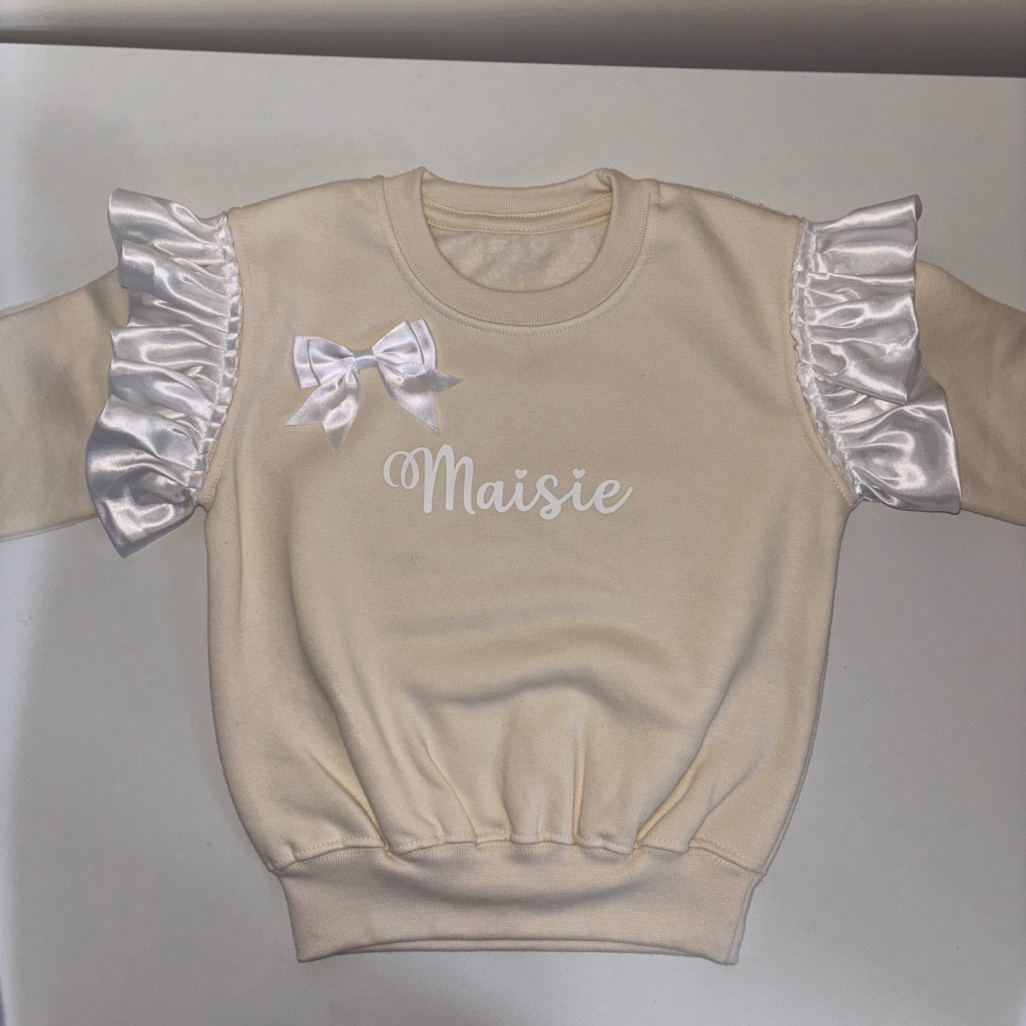 Beige frill shoulder jumper