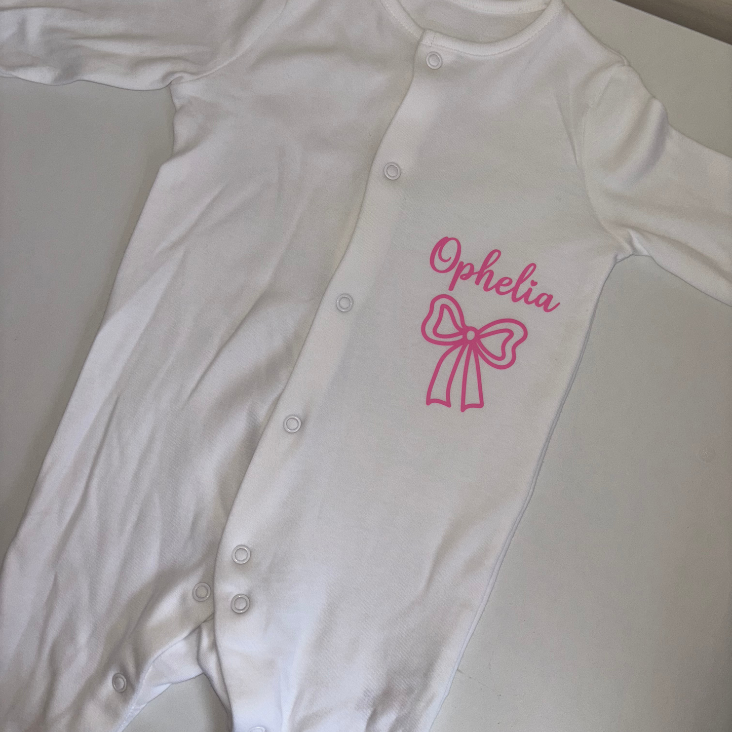 Personalised bow design sleepsuit
