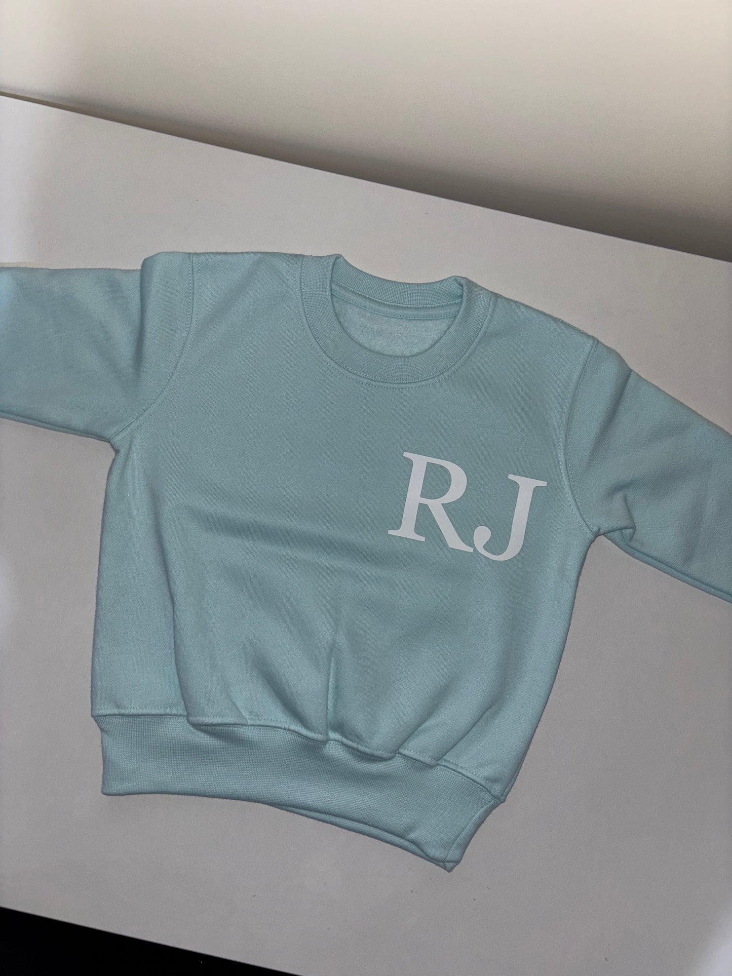 Initial front, name back sweatshirt