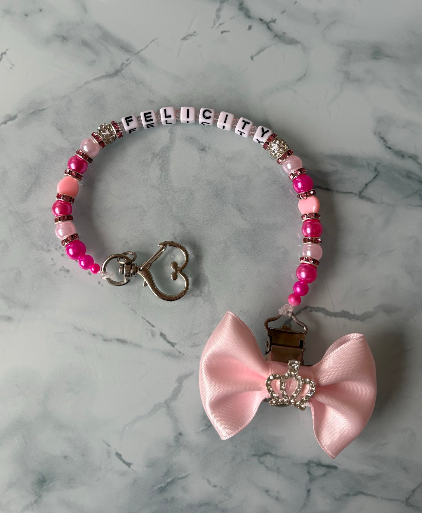 Double pink dummy clip with a handmade bow