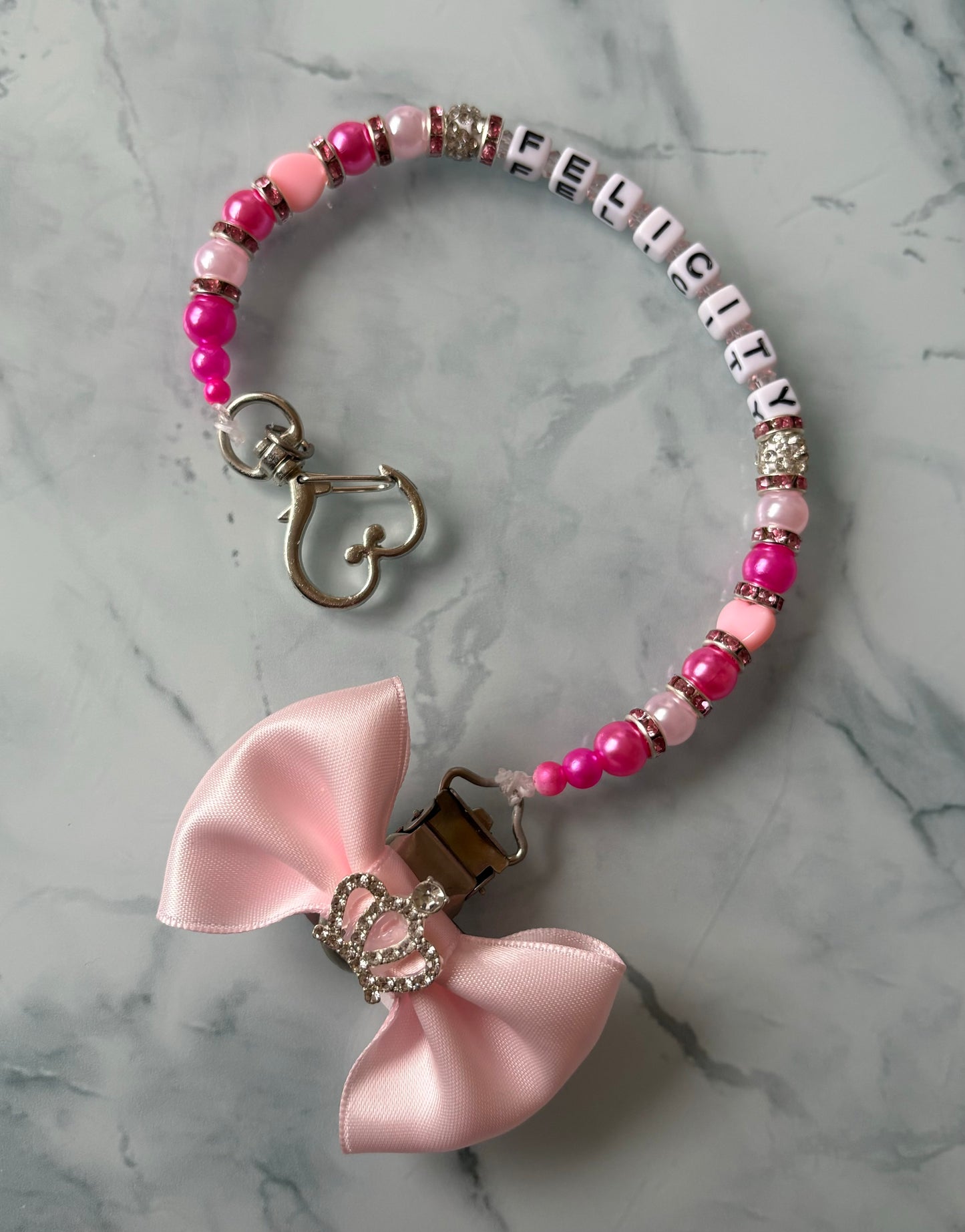 Double pink dummy clip with a handmade bow