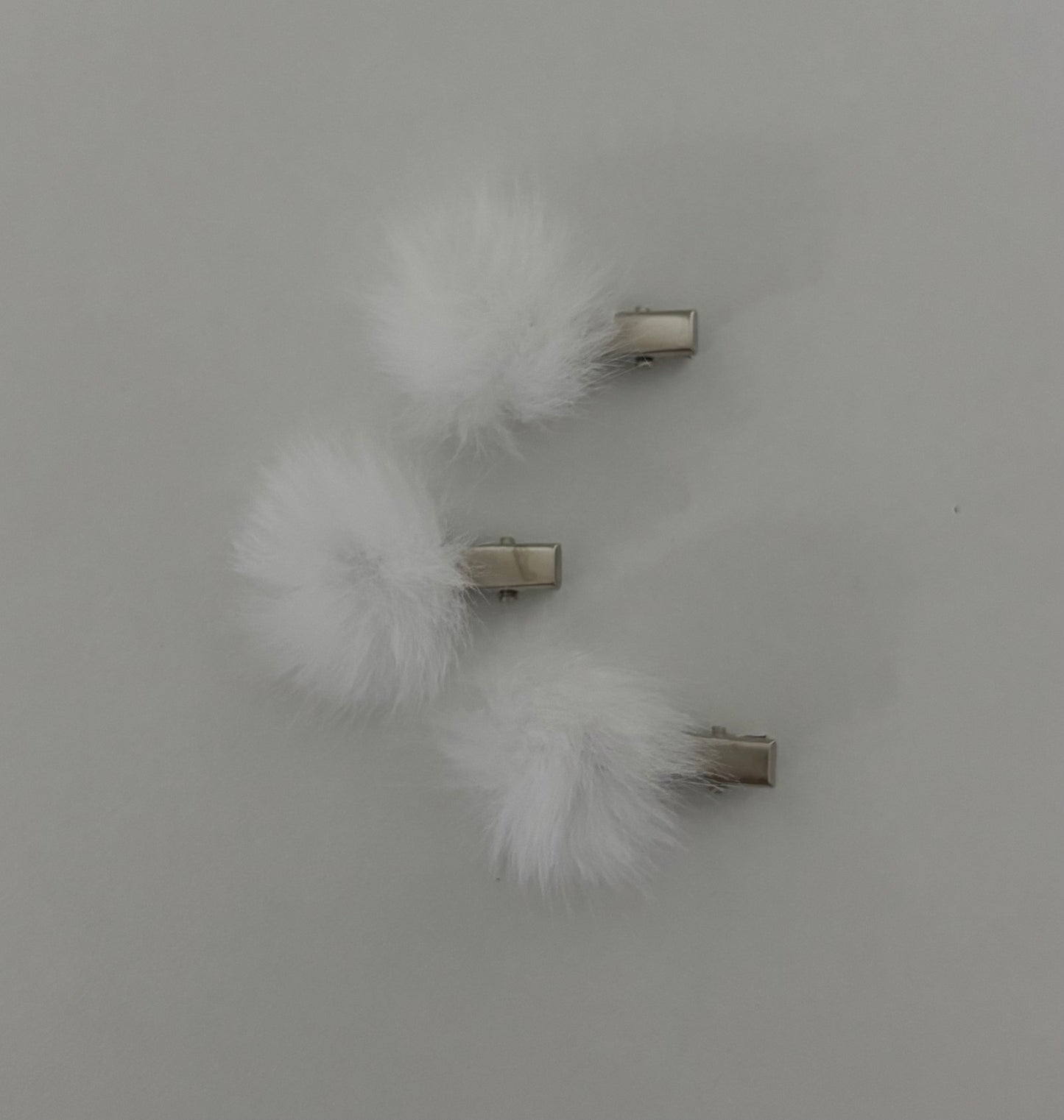 White pom pom clip